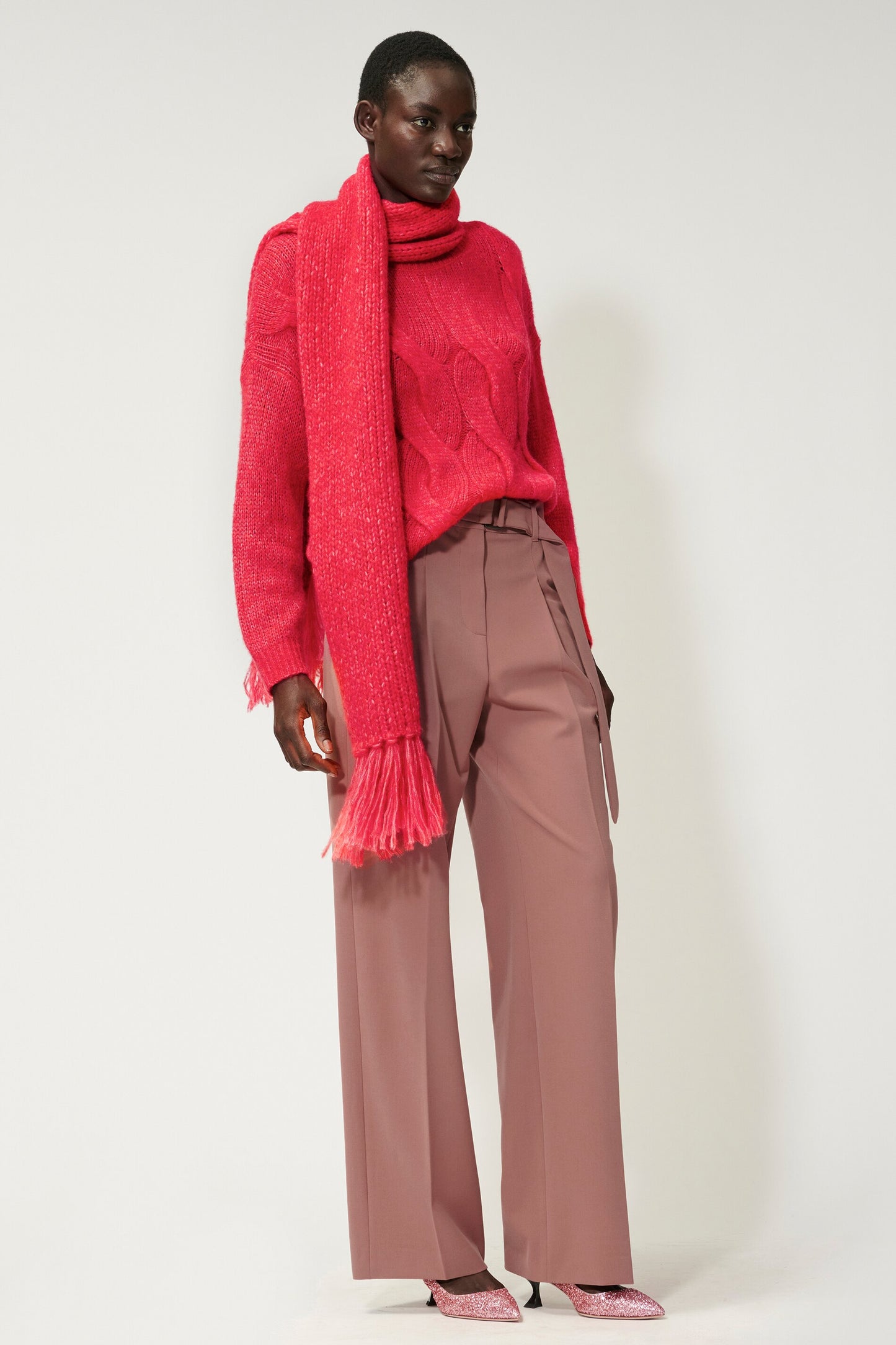 Knitted sweater with cable pattern