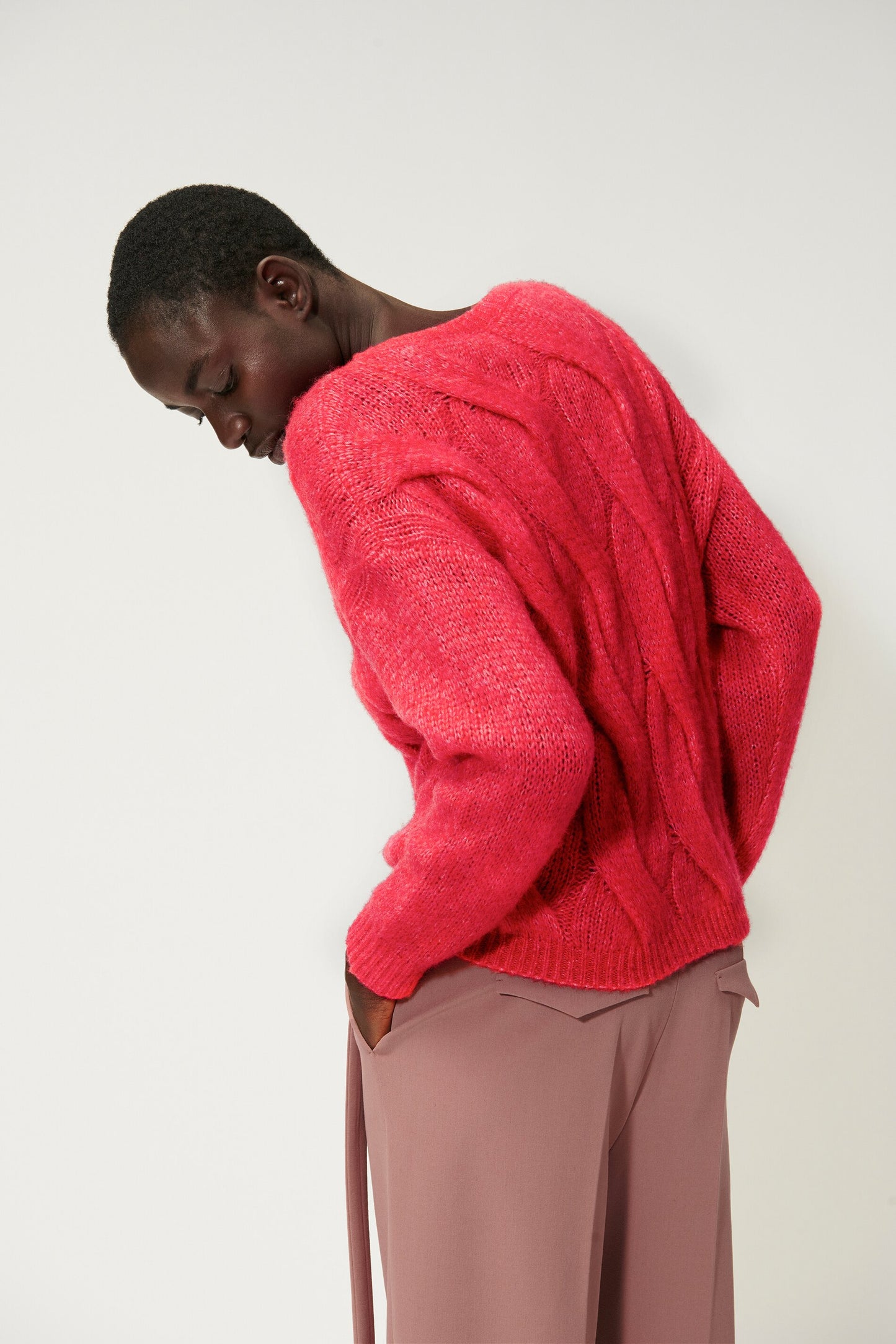Knitted sweater with cable pattern