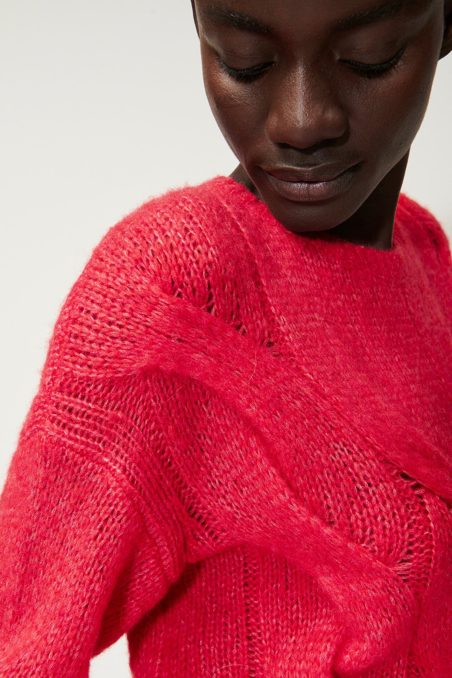 Knitted sweater with cable pattern