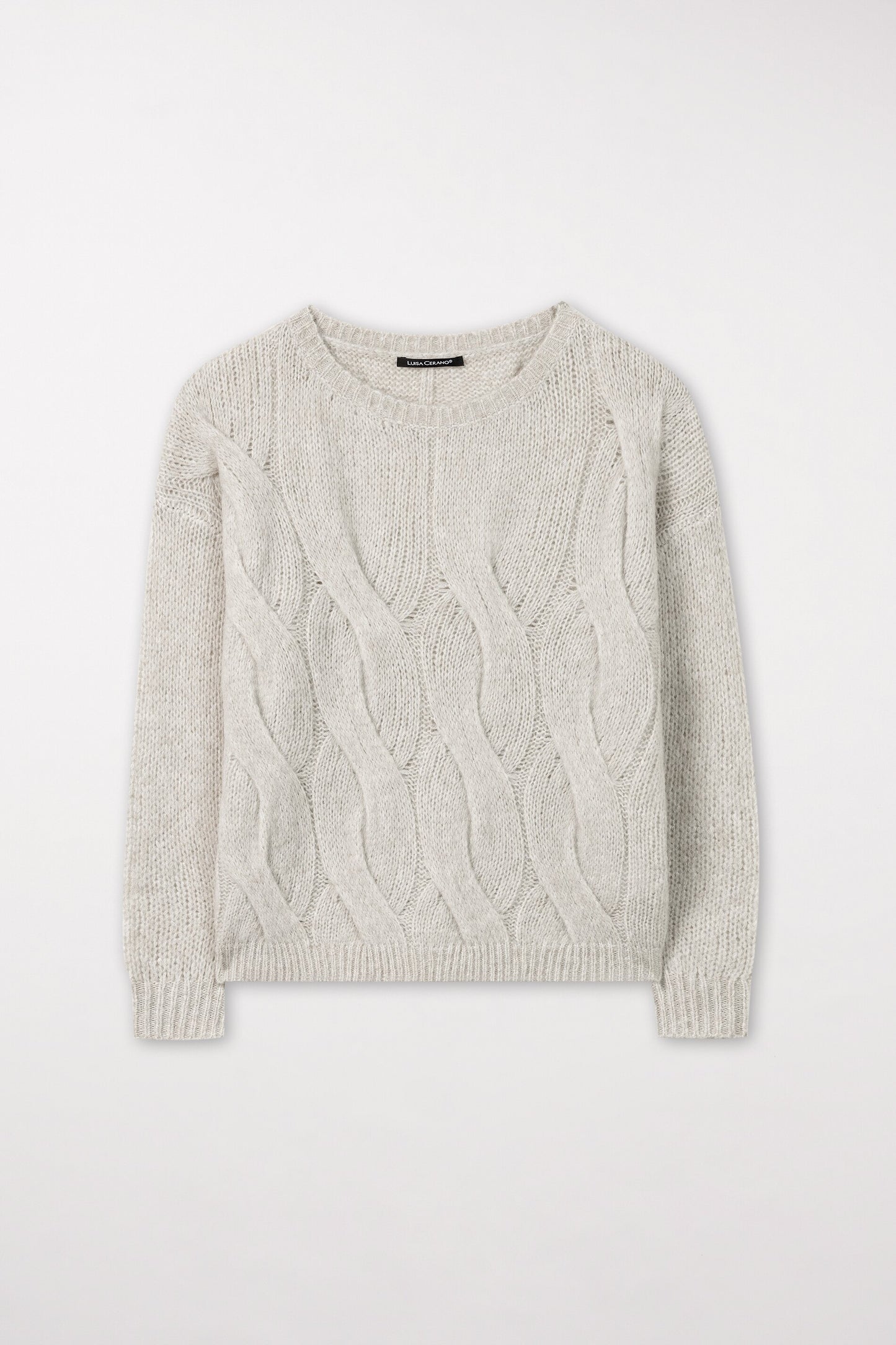 Knitted sweater with cable pattern