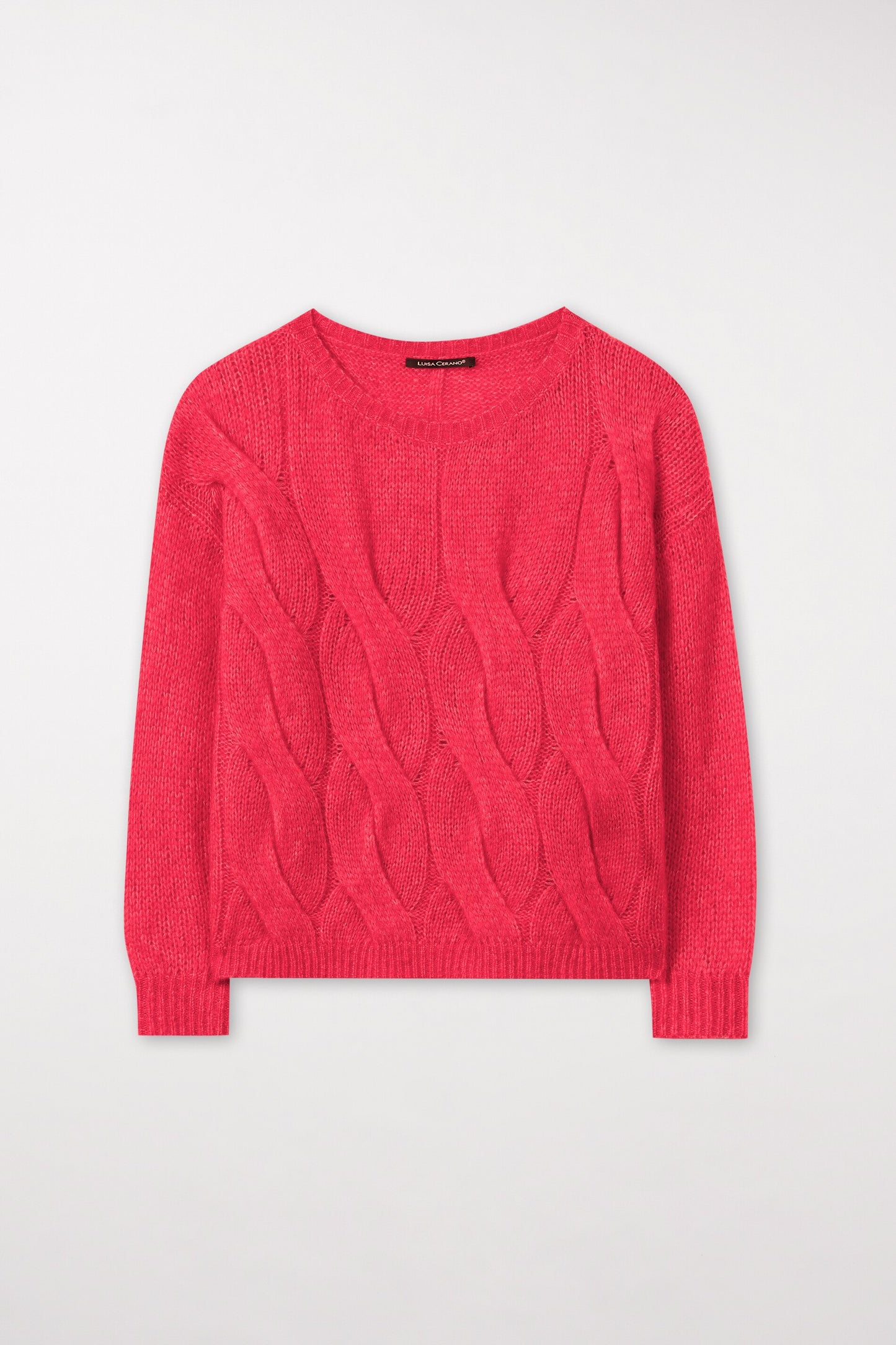Knitted sweater with cable pattern